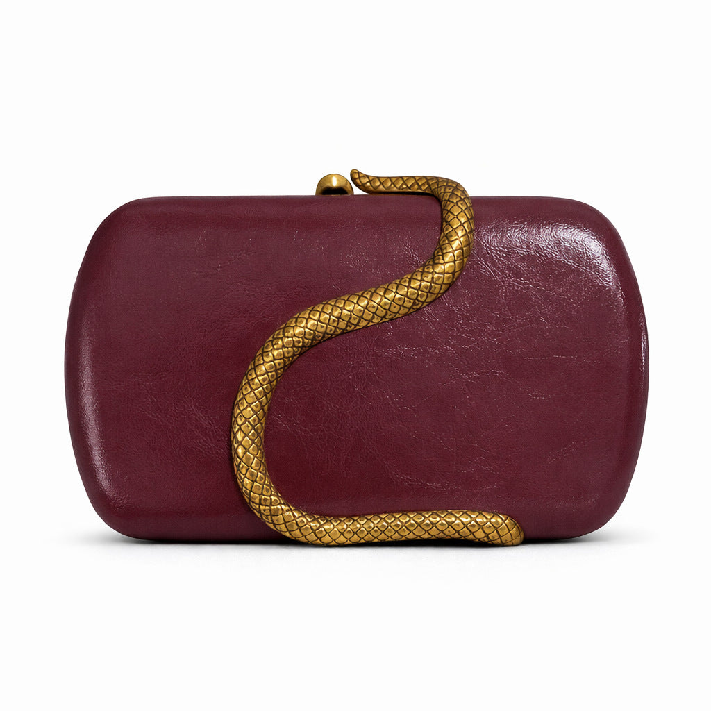 Snake-embossed metal shoulder bag