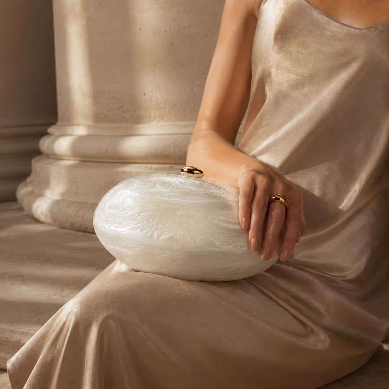 Acrylic pearlescent oval shoulder bag and clutch bag