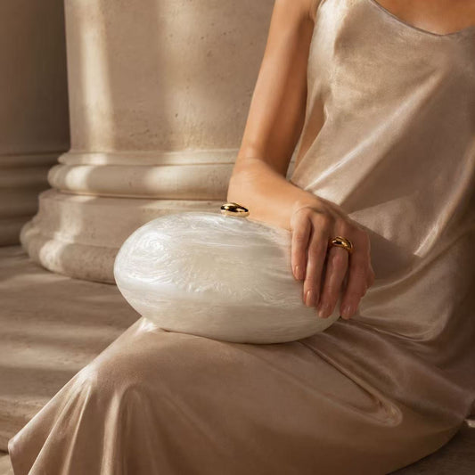 Acrylic pearlescent oval shoulder bag and clutch bag